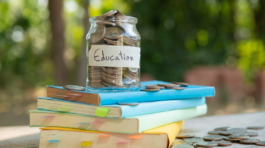 putting-money-coins-saving-glass-bottle-concept-investment-mutual-fund-finance-business-placed-textbook-content-money-saving-education